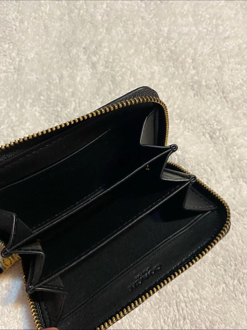 Coach Black Pebbled Leather Zip Card Holder with Gold 'C' Accent
